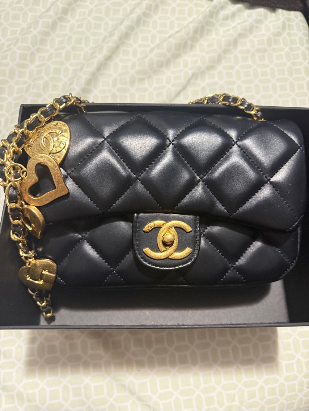 CHANEL Black Quilted Shoulder Bag with Gold Charm Chain